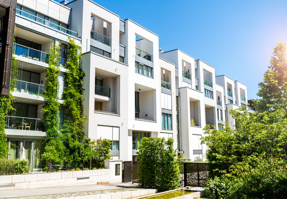 block of multi level apartments with trees